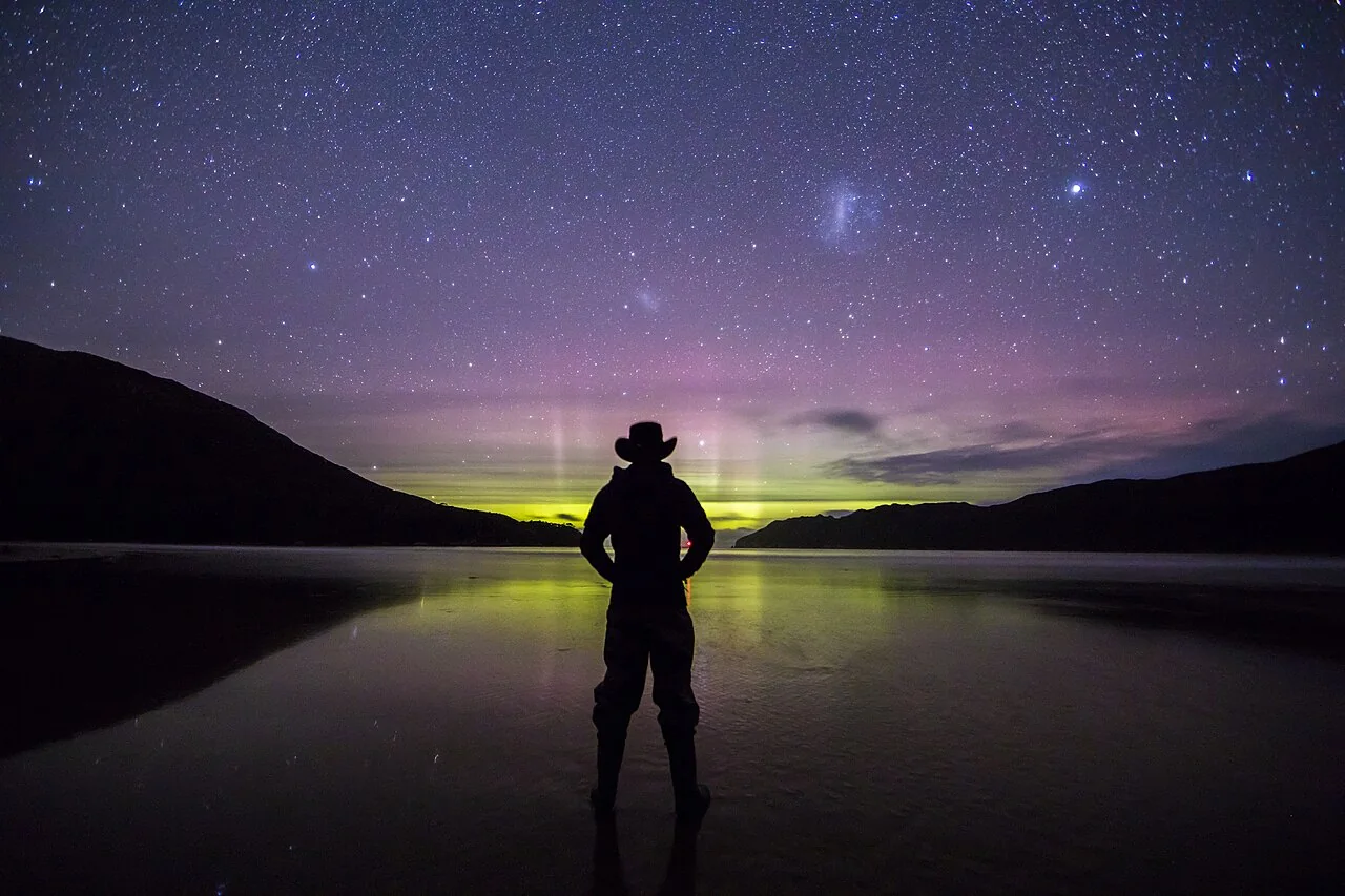 Aurora Australis glows along the horizon from New Harbour Beach in Tasmania